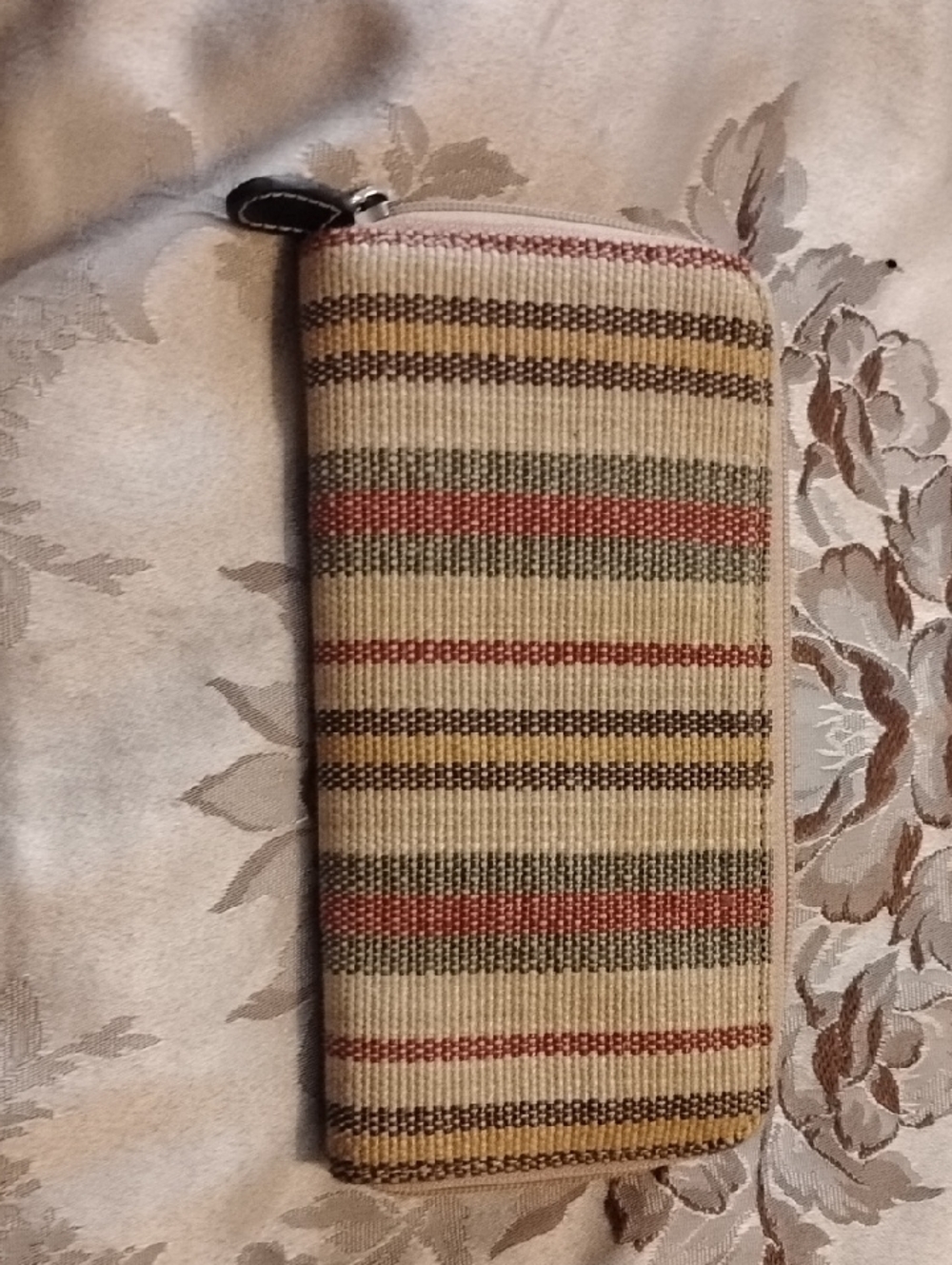 Striped Wallet Striped Wallet With Zipper Closure.